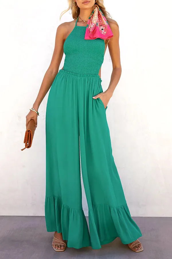 Solid color halter neck open back flared jumpsuit