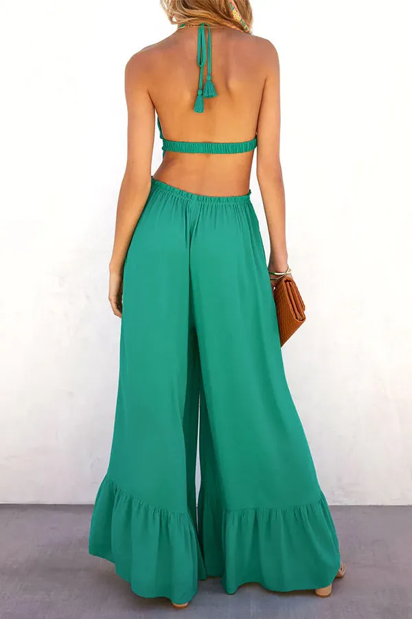 Solid color halter neck open back flared jumpsuit